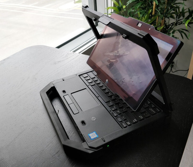 Laptop screen mid-flip.